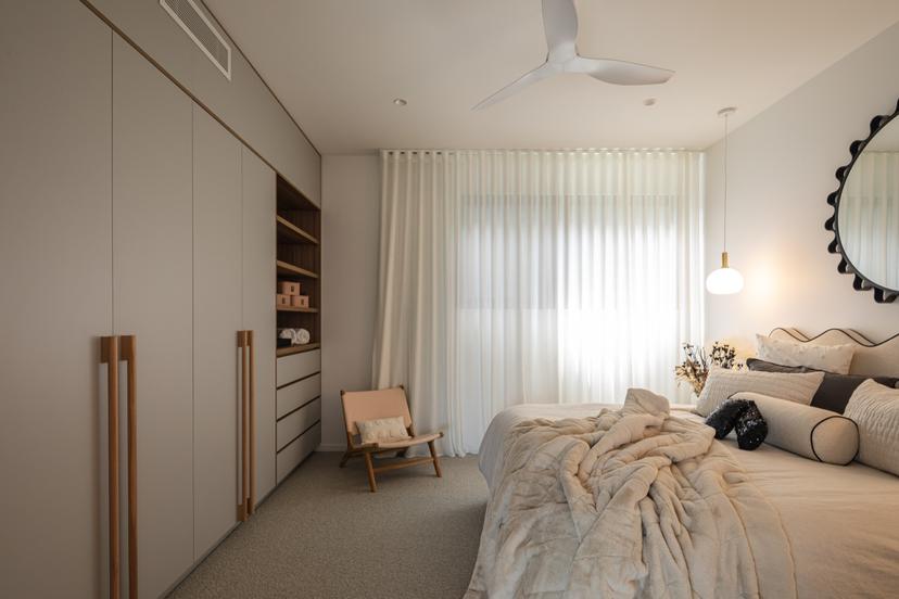Guest spaces mirror the same soft tones and natural textures for a unified experience.