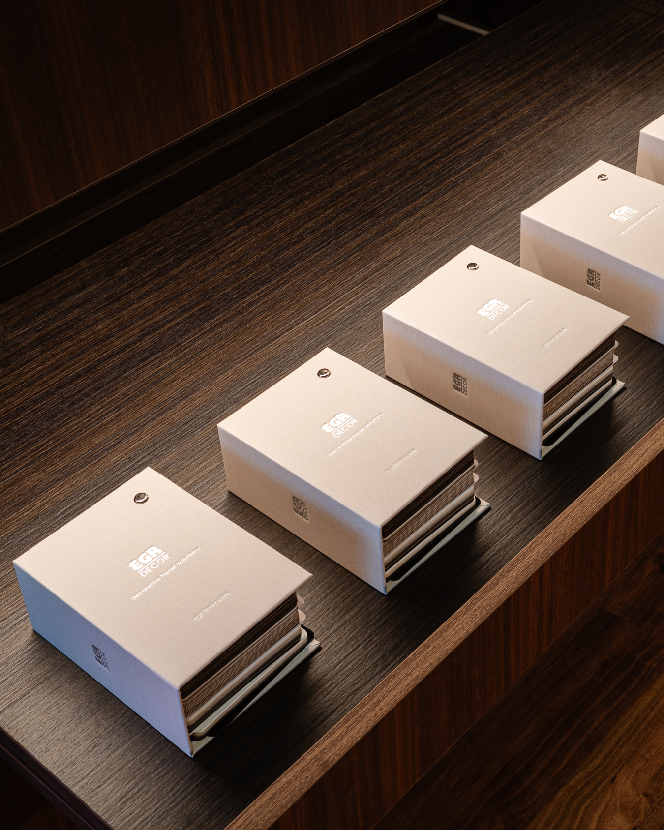 EGR Decor sample boxes on a timber shelf
